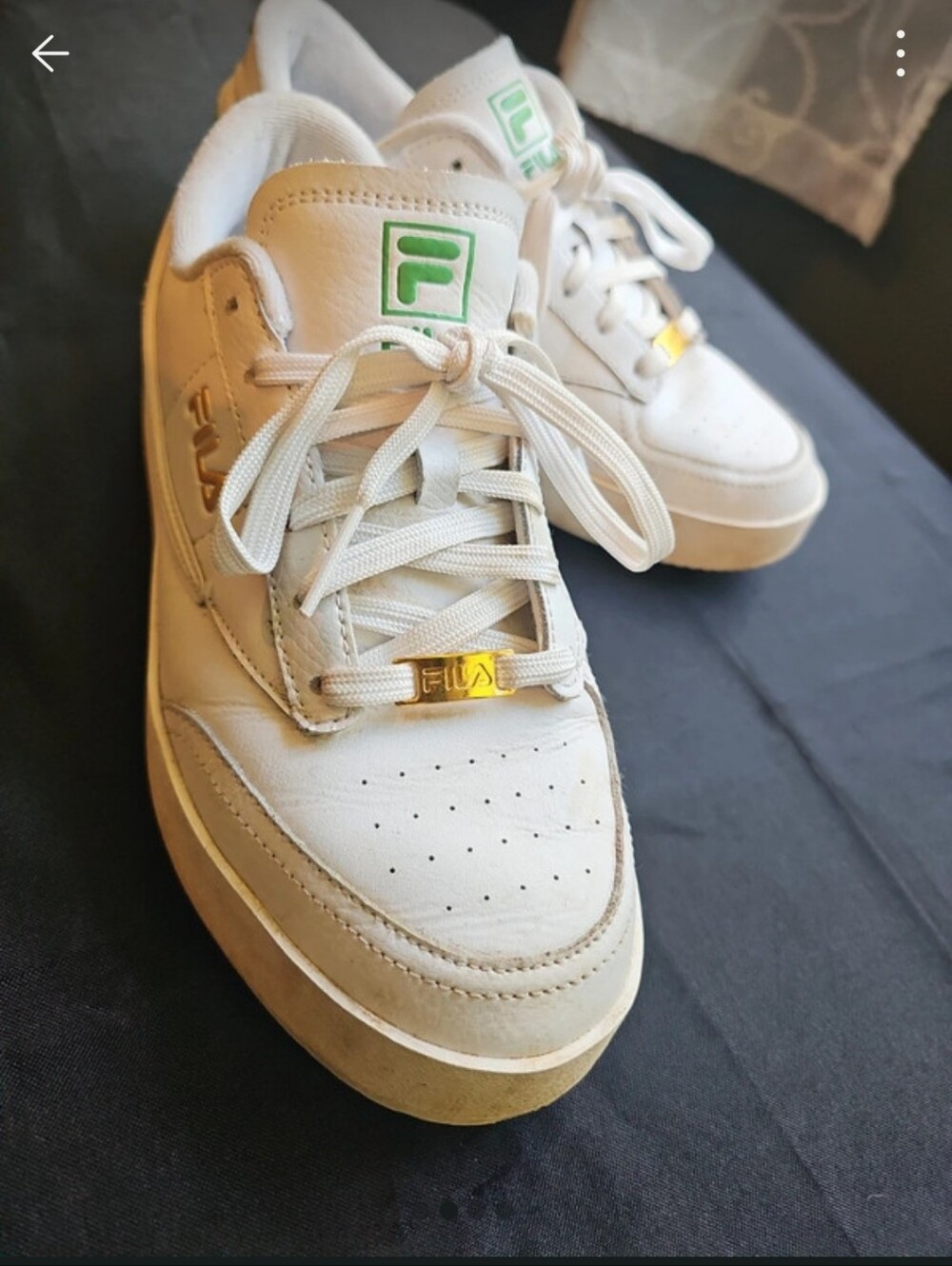 Fila White Sneakers with Green Accents and Gold Logo Hardware